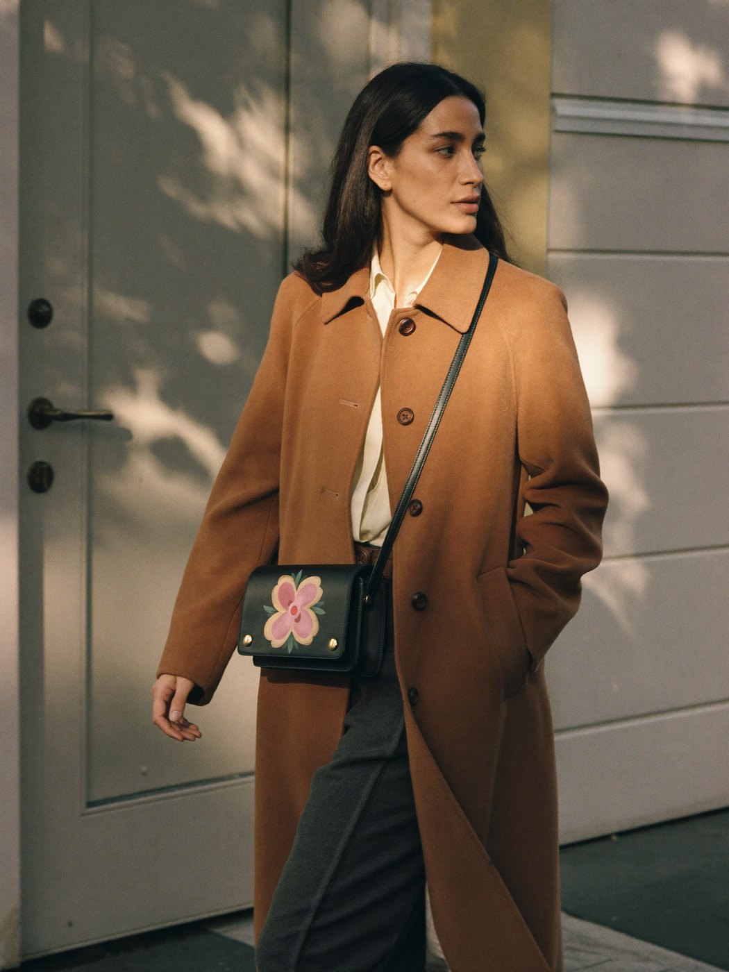 Hand-painted crossbody through a sunlit London doorway